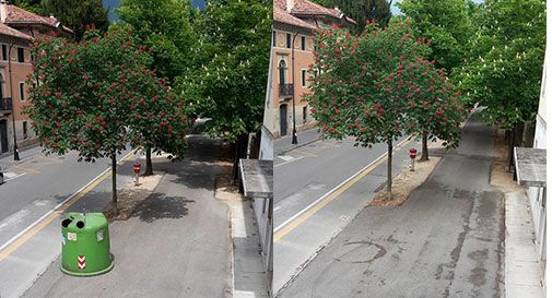 Campane del vetro in mezzo al viale e all'entrata della città